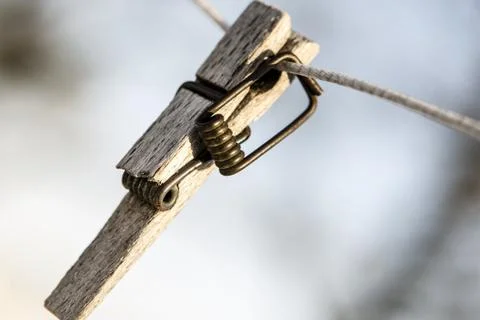 Broken clothespin on the wire Stock Photos
