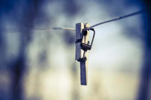 Broken clothespin on the wire Stock Photos
