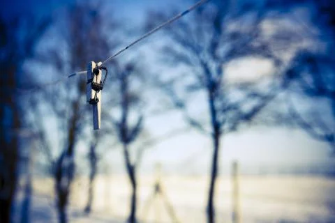 Broken clothespin on the wire Stock Photos