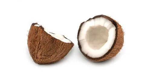 A broken coconut on a white background. Macro photo. Stock Photos