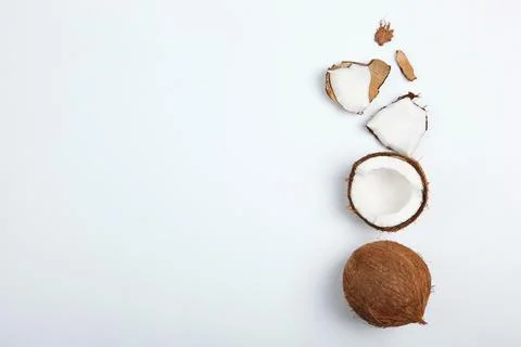 Broken coconut on a white background. Stockfoto's