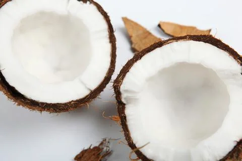 Broken coconut on a white background. 写真素材