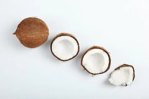 Broken coconut on a white background. Stockfoto's