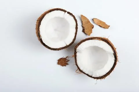 Broken coconut on a white background. Stock-Fotos