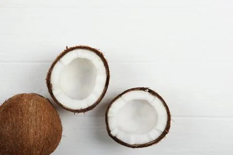 Broken coconut on a white background. Fotos Stock