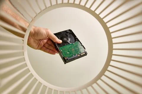 A broken computer hard drive is discarded and recycled in the trash. View f.. Stock Photos