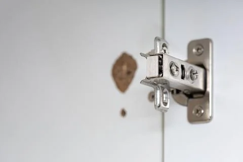 Broken concealed hinge on cabinet door Stock Photos