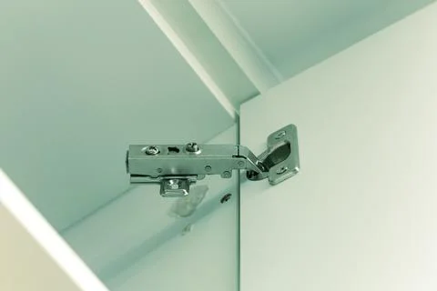 Broken concealed hinge on cabinet door Stock Photos