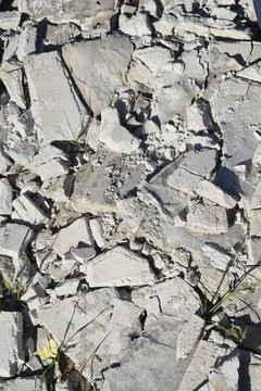 Broken concrete rubble and construction debris on the ground Stock Photos