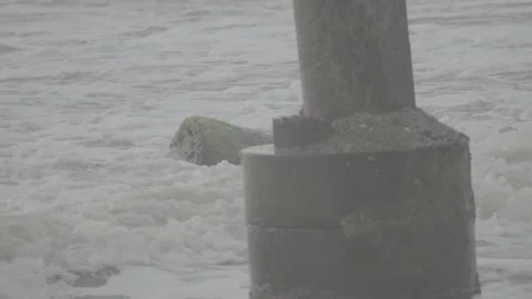 Broken Concrete Structure in Middle of Ocean Hit by Powerful Waves S-Log3 Video stock 313092904