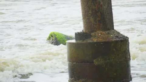 Broken Concrete Structure in Middle of Ocean Hit by Powerful Waves Video stock 313092938
