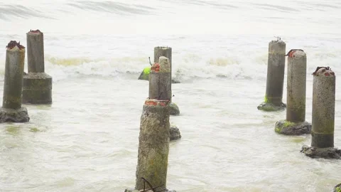 Broken Concrete Structure in Middle of Ocean Hit by Powerful Waves Stock Footage 313092975