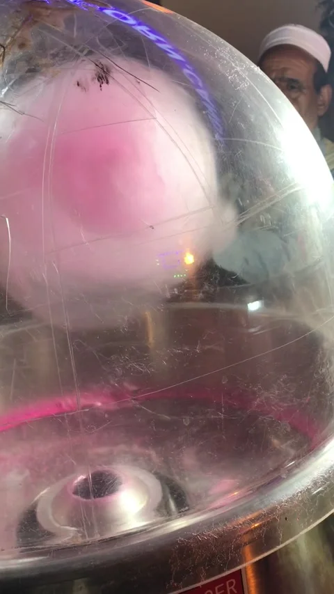 Broken cotton candy maker making cotton candy Stock Footage 222951781