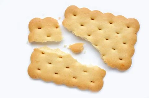 Broken cracker. Square crackers isolated on white background.  Stock Photos