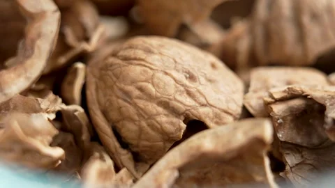 Broken crushed cracked organic empty walnut shells Video stock 279473146