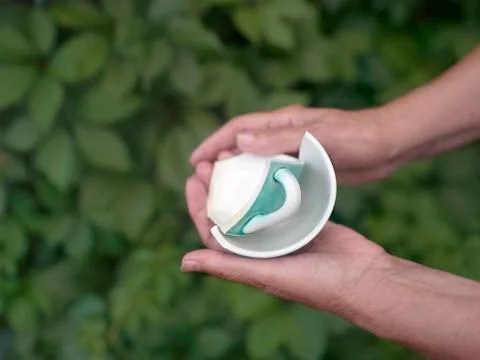 Broken Cup In Hands Photos