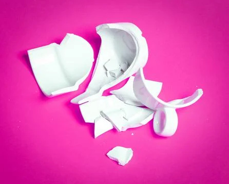 Broken cup isolated on a solid background Foto stock