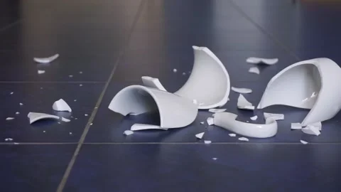 Broken cup. Shards from the cup are scattered on the floor Stock Footage 139569337