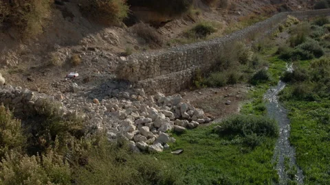 Broken dam near stream Stock Footage 230098300