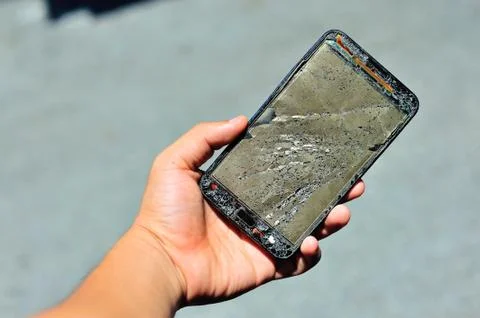 Broken damage  mobile in sun light Stock Photos