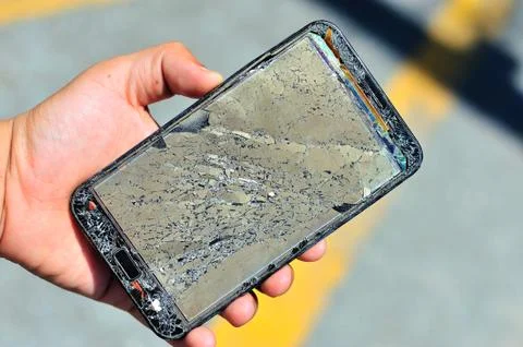 Broken damage  mobile in sun light Foto stock