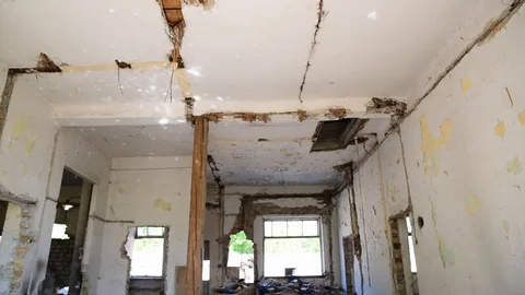 Broken damaged and collapsed ceiling and roof of old dark house Stock Footage 106466696