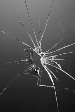 Broken dark glass window Stock Photos