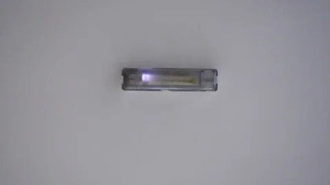 Broken daylight blinking on ceiling. Bottom view with soft focus. Stock Footage 126479040