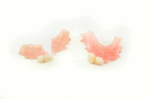 Broken denture and perfect denture Stock Photos
