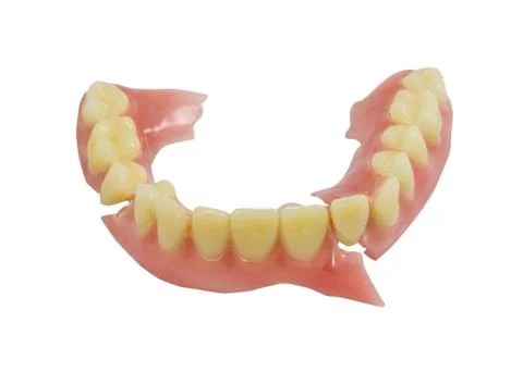 Broken denture isolate on white background Stock Photos
