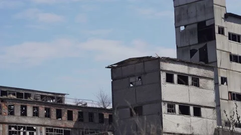 Broken destroyed concrete and brick buildings of an old abandoned factory Stock Footage 210888955