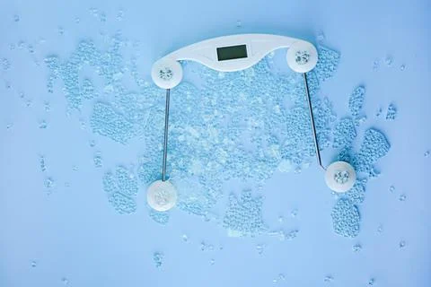 Broken digital human scale on the floor for measuring people.Cracked weight Stock Photos