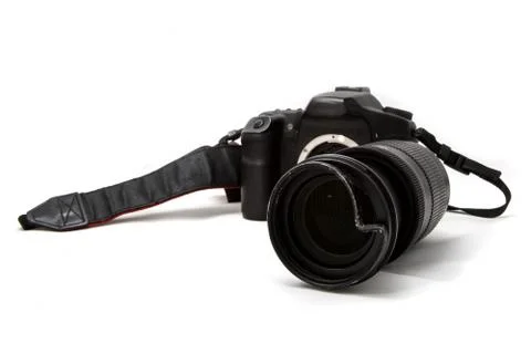 Broken digital SLR camera, dented protective filter on the zoom lens. Will be Foto stock