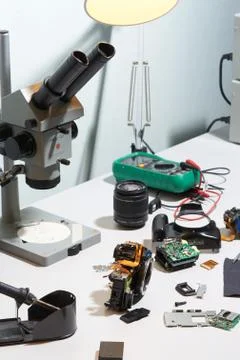 Broken digital SLR camera disassembled Stock Photos