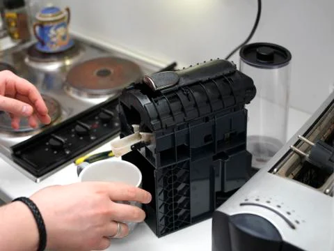 Broken disassembled coffee machine Fotos Stock