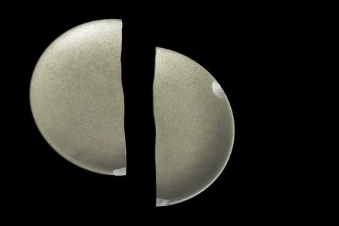 A broken dish on a black background Stock Photos