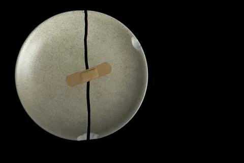 A broken dish on a black background Foto stock