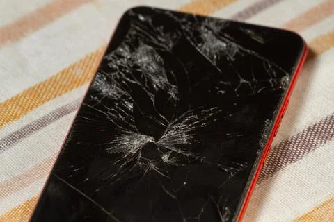 Broken display, close-up screen of a touchscreen phone. Stock Photos