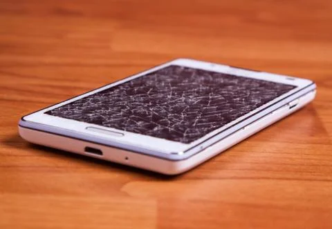 Broken display on white mobile phone Stock Photos