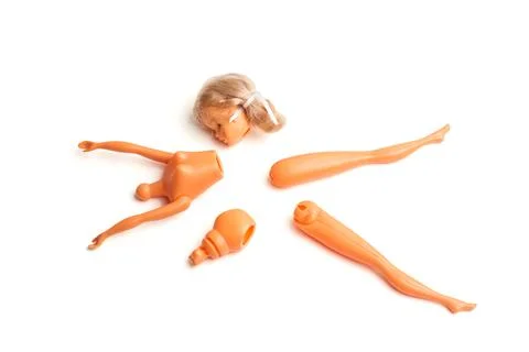 A broken doll on a white background Stock Photos