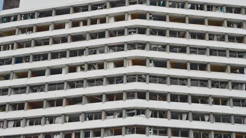 Broken down building. Abandoned, decaying Windows are broken or missing. Stock Footage 325766649