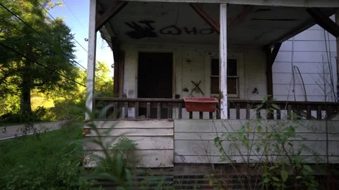 Broken down front porch of abandoned house in coal mining town in West Virginia. Stock Footage 280203010