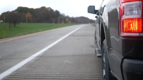 Broken Down Vehicle on Highway Series - 3 - Close up of four way flasher Stock Footage 289686325