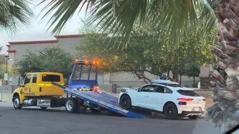 Broken down Waymo self driving car being towed Stock Footage 336590702