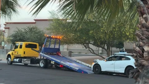Broken down Waymo self driving car being towed Stock Footage 336590711