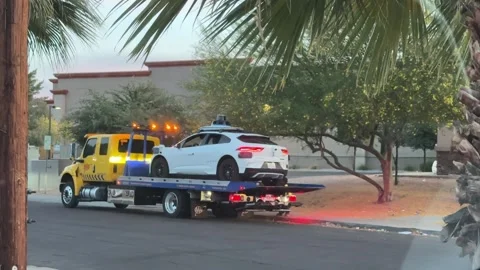 Broken down Waymo self driving car being towed Stock Footage 336590712