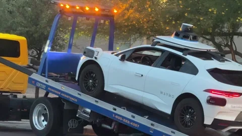 Broken down Waymo self driving car being towed Stock Footage 336590722