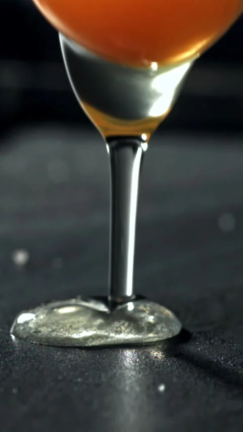 The broken egg falls into the pan. Filmed on a high-speed camera at 1000 fps Stock Footage 335363793