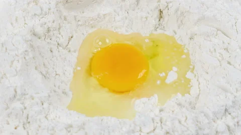 Broken egg on flour, means for making bread, rotation, 4k Video stock 53210975