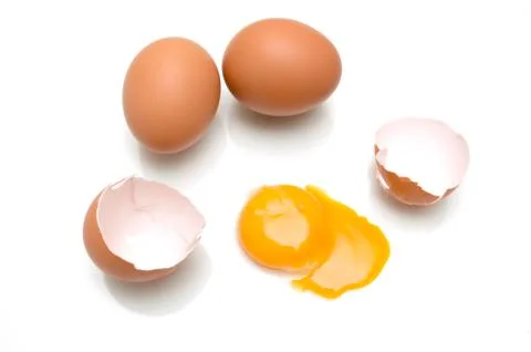 Broken egg isolated on white background Stock Photos